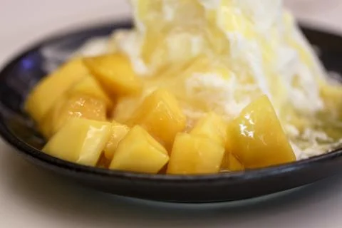 Pieces of mango and iceflake Stock Photos