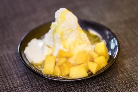 Pieces of mango and iceflake Stock Photos