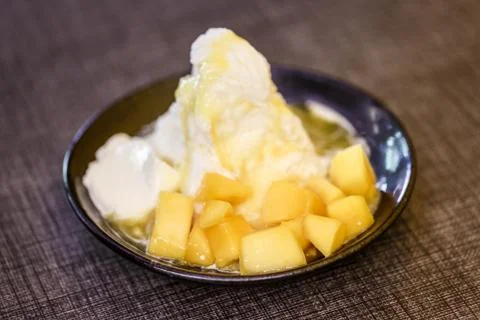 Pieces of mango and iceflake Stock Photos