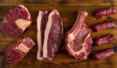 Pieces of meat of different types on the board. top Stock Photos