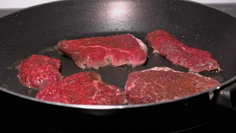 Pieces of meat fried in a frying pan, close up Stock Footage 87805986