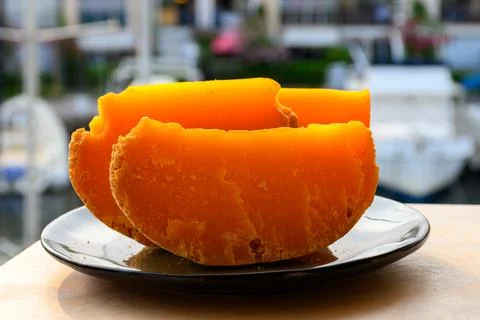 Pieces of native French aged cheese Mimolette, produced in Lille with greyi.. Stock Photos