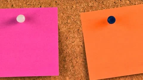 Pieces of note paper on a cork bulletin board Stock Footage 21302438