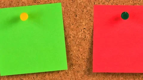 Pieces of note paper on a cork bulletin board Stock Footage 21302463