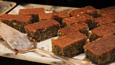 Pieces of nut chocolate pie on a tray in a coffee shop. Stock Footage 327858899
