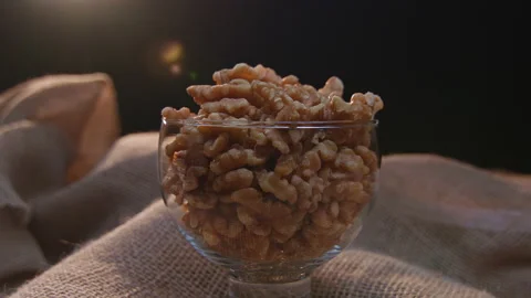 Pieces of nuts in a container Stockbeeldmateriaal 131454995