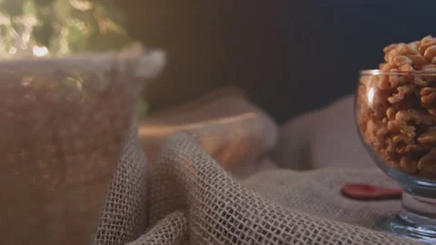 Pieces of nuts in a container Stockbeeldmateriaal 131456303