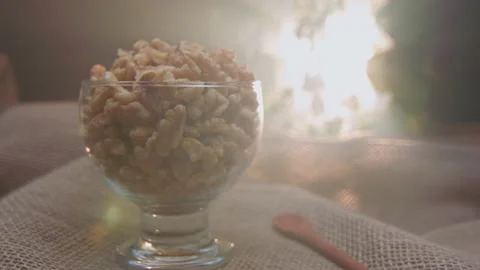 Pieces of nuts in a container Stockbeeldmateriaal 131461904