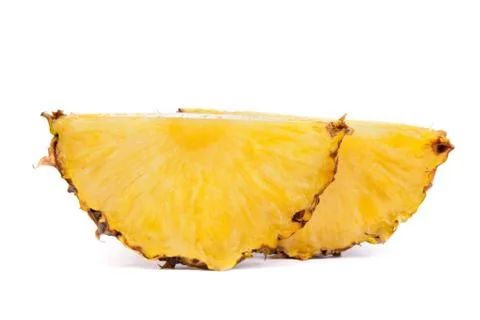 Pieces  of pineapples isolated on white Stock Photos