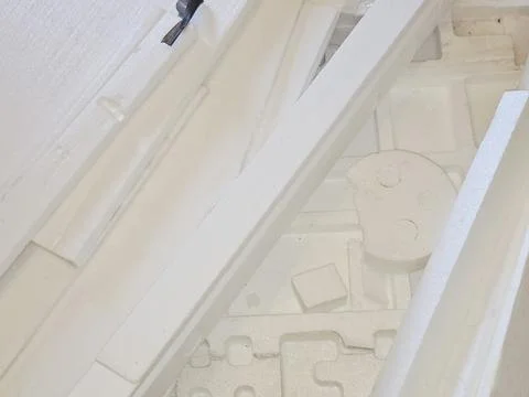 Pieces of Polystyrene foam, a lightweight, rigid plastic made from styrene .. Stock Photos