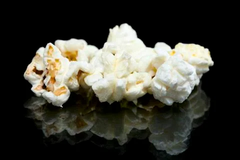 Pieces of popcorn on the table Stock Photos