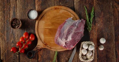 Pieces of raw beef are placed on a cutting board. Stock Footage 139151025