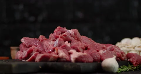 Pieces of raw beef fall on the table. Stock Footage 139150915