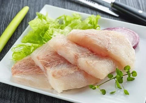 Pieces of raw fish Stock Photos