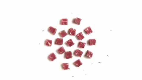 Pieces of Raw Meat Rotating on Table Stock Footage 318409988