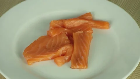 Pieces of raw salmon on the plate Stock Footage 174808567