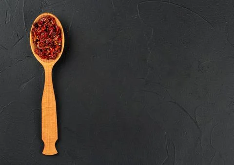 Pieces red pepper in spoon Foto stock