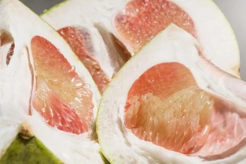 Pieces of red Pomelo fruit, selective focus Stock Photos