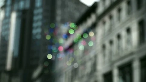 Pieces of reflective metal hanging on strings in the city  Stock Footage 83482520