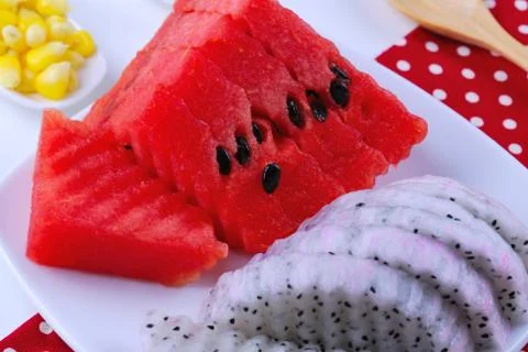 Pieces of refreshing watermelon and dragon fruit Stock Photos