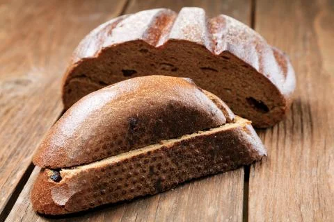 Pieces of rye bread isolated on a rural table Stock Photos