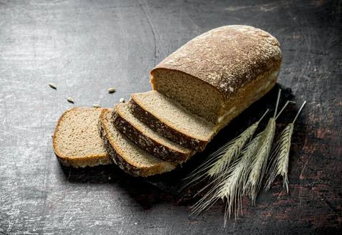 Pieces of rye bread with spikelets. Stock Photos