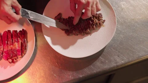 Pieces Of Sliced Fried Steak. Chef Arranges Dish On Plate. Stock Footage 275524287