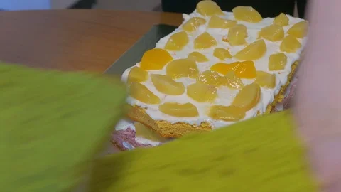 From the pieces of sponge cake to make triangular pieces Stock Footage 123577682