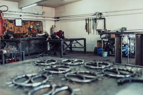 Pieces of steel lined up on the table ready for the welding process Stock Photos