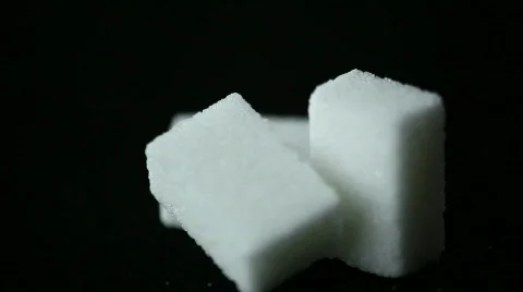 Pieces of sugar on a black background Stock Footage 359554