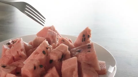 Pieces of watermelon. Eating with a fork. The average plan. Stock Footage 204947411