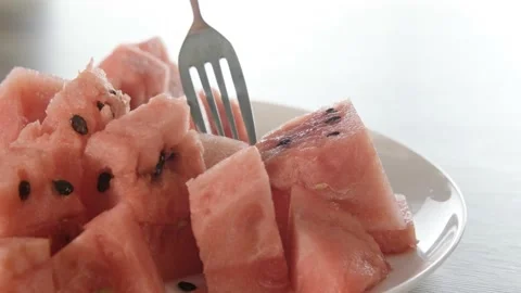 Pieces of watermelon. Eating with a fork. Close. Stock Footage 204947590