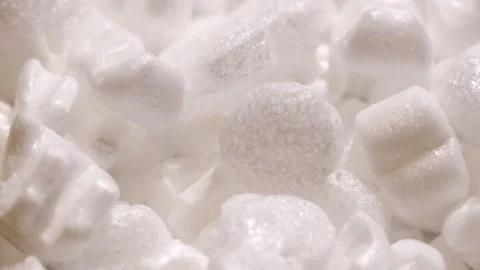 Pieces of white foam rotate in a circle. packaging material Stock Footage 222998939