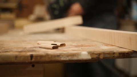 Pieces of wood laying on table in workshop closeup Stock Footage 102045441