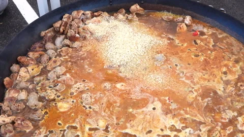 Piella Simmering In A Large Pan Stock Footage 303505452