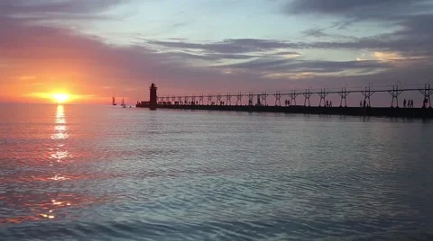 Pier and Lighthouse at Sunset Video stock 42159530