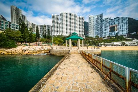 Pier and skyscrapers at Repulse Bay, in Hong Kong, Hong Kong. Stock Photos