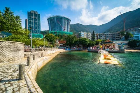 Pier and skyscrapers at Repulse Bay, in Hong Kong, Hong Kong. Stock Photos