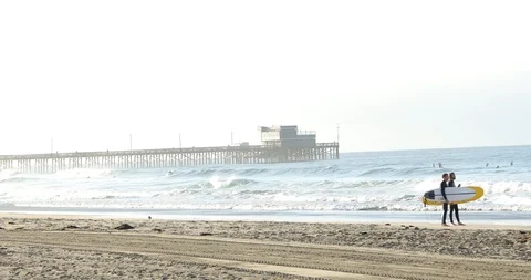 Pier and Surfers Stock Footage 101894697
