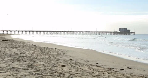 Pier and Surfers Stock Footage 102150763