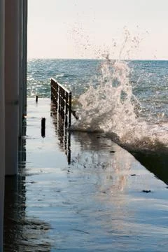 Pier and wave Stock Photos
