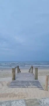 Pier on the Beach at Dawn Stock Photos