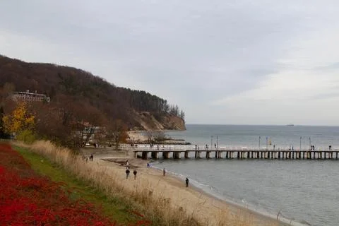 Pier on the beach pier in the gray autumn day Stock Photos