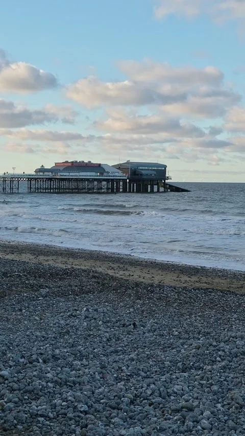 Pier on the beach at sunset Video stock 304392547