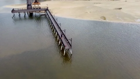 Pier in calm waters, drone view all around Stock Footage 166922495