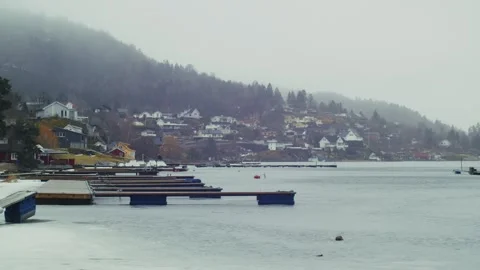 A pier on a canal in Oslo with a dramatic backdrop, Norway Stock Footage 333707385