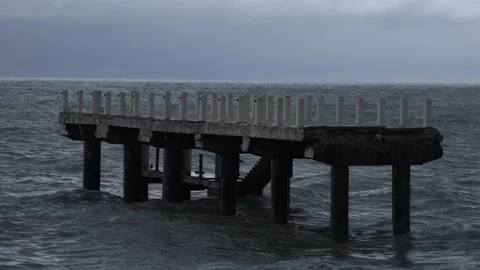 Pier destroyed by a wave on the sea Stock Footage 171856214