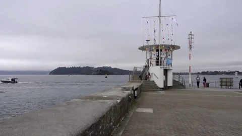 Pier with flags on watch tower. Stock Footage 138958428