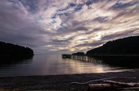 Pier on Lake at Sunset Stock Photos