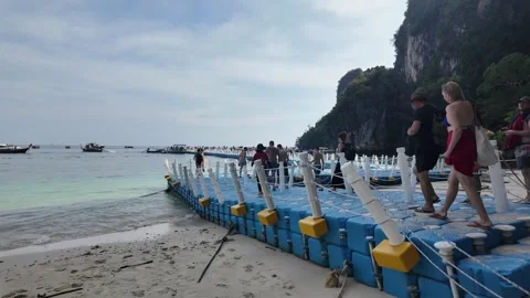 Pier leading to moored excursion boats on Hong Island Thailand Krabi day trip Stock Footage 323896812